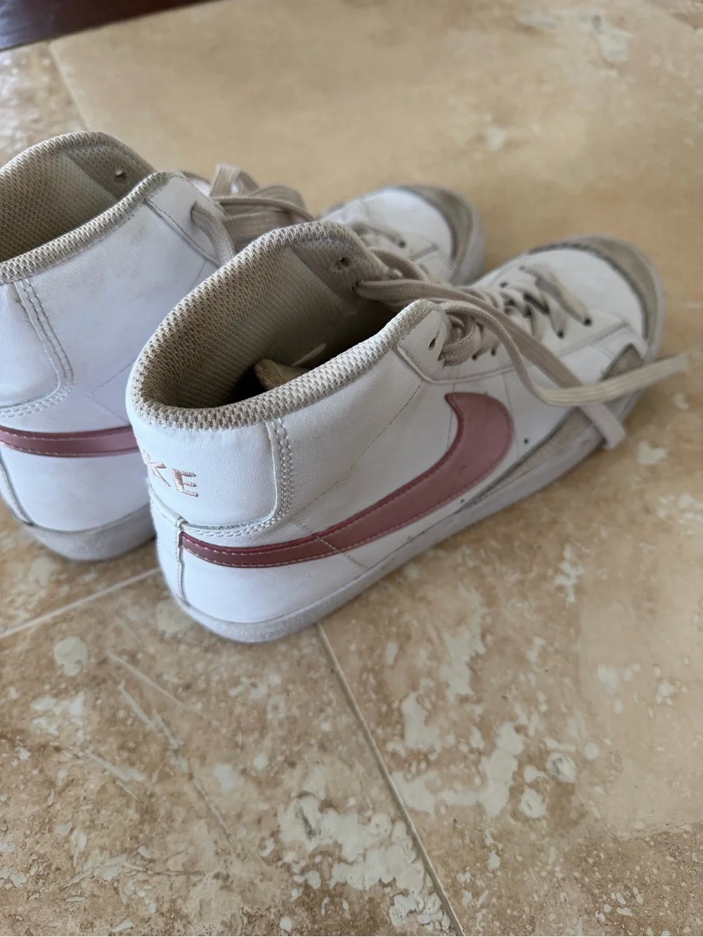 Nike Women’s White High-Top Sneakers with Pink Swoosh Accent